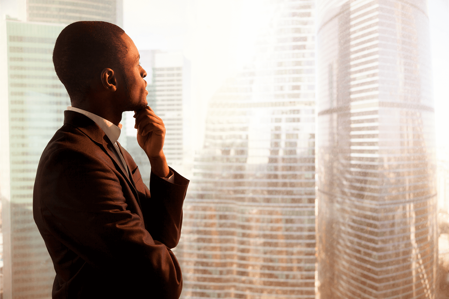 man staring through window